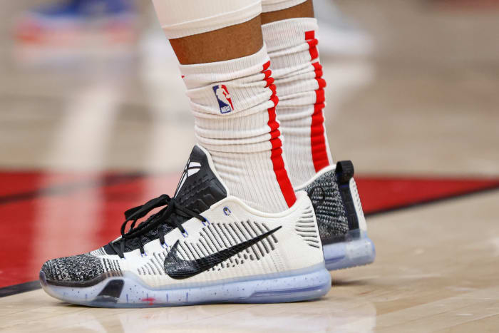 View of white and black Nike Kobe shoes.